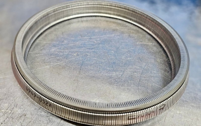 And here’s a brand-new one — included in every CVT overhaul we perform. (Real photo, Nissan CVT belt from our inventory)